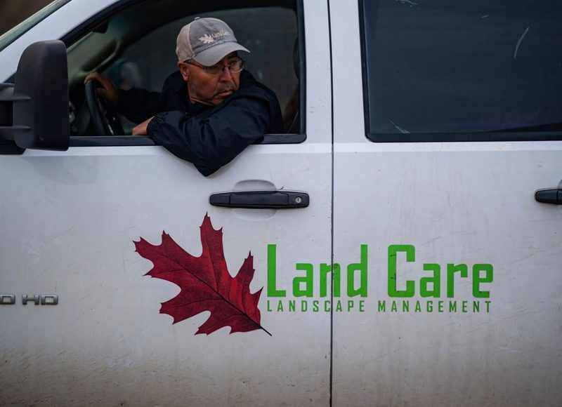 Land Care service truck with company branding, ready to respond